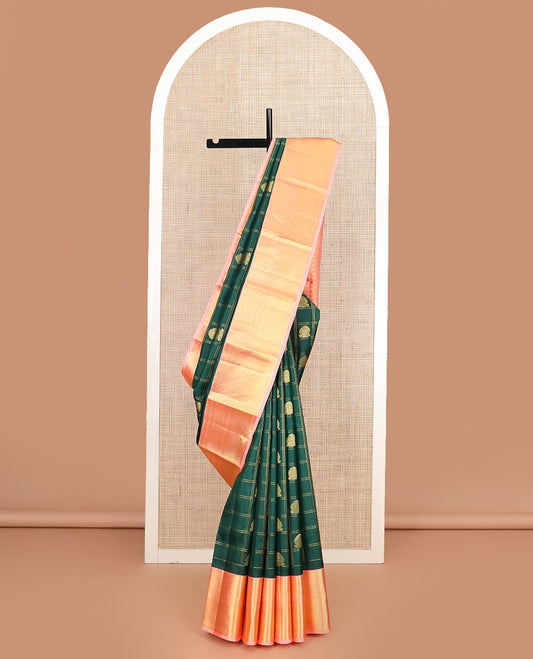 Green butta enclosed zari checked silk saree, contrast temple border of thilakam mokku, muthu, kodi visiry, mayil, and mayil kann designs, and geometric patterned pallu