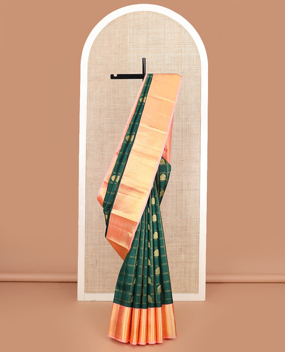 Green butta enclosed zari checked silk saree, contrast temple border of thilakam mokku, muthu, kodi visiry, mayil, and mayil kann designs, and geometric patterned pallu