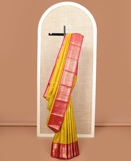 Yellow zari buttas silk saree, contrast border of mayil kann, and kodi visiry designs, and pallu of floral designs