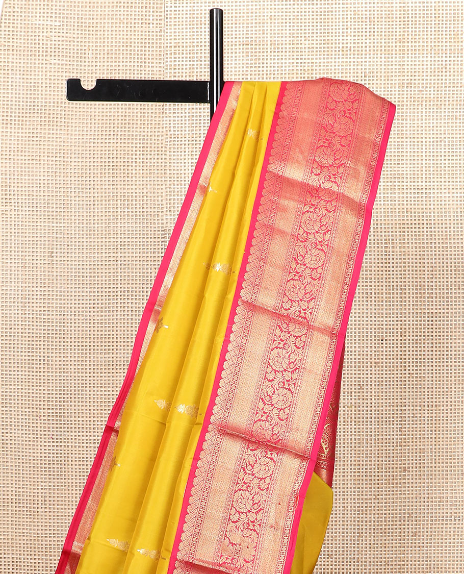 Yellow zari buttas silk saree, contrast border of mayil kann, and kodi visiry designs, and pallu of floral designs