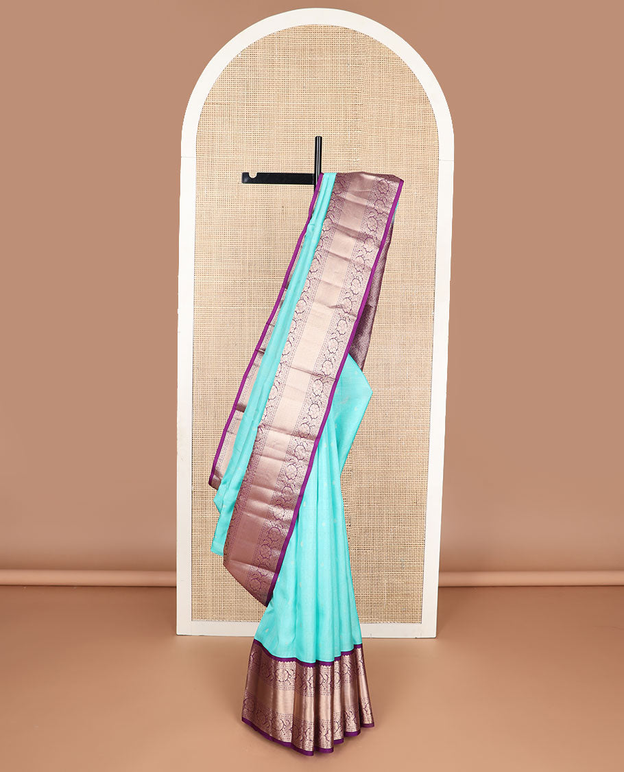 Light blue striped , buttas silk saree with contrast rettai pettu border of thilakam mokku, paun, muthu design & zari design pallu
