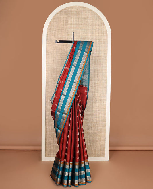 Rust zari buttas silk saree, contrast border of manga mokku,muthu,kathir & rudraksham motifs & geometric patterned pallu