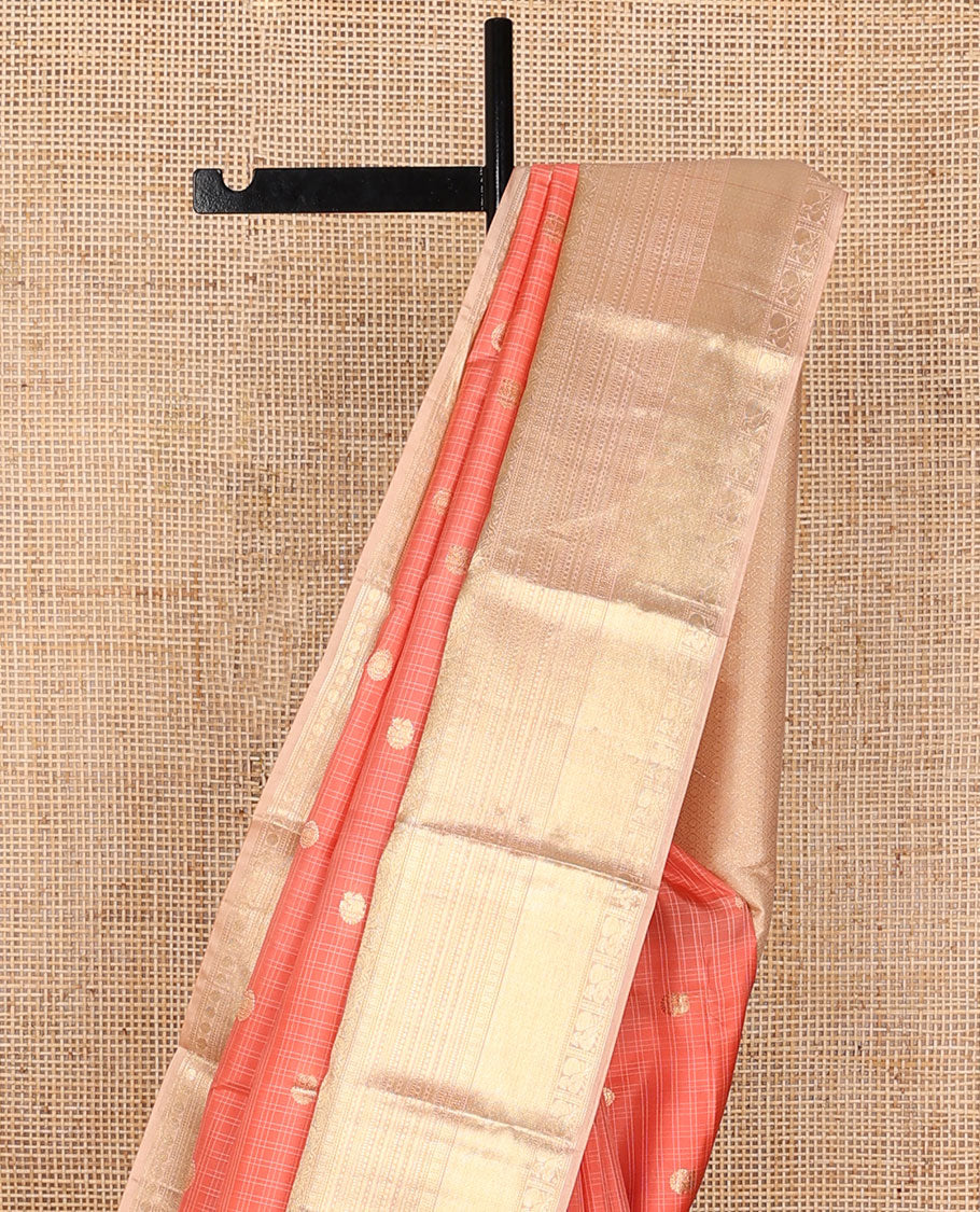 Peach checked annam chakram buttas silksaree, contrast jaal pallu & border of muthu, cross kamalam,mayil kann,neli & mayil designs