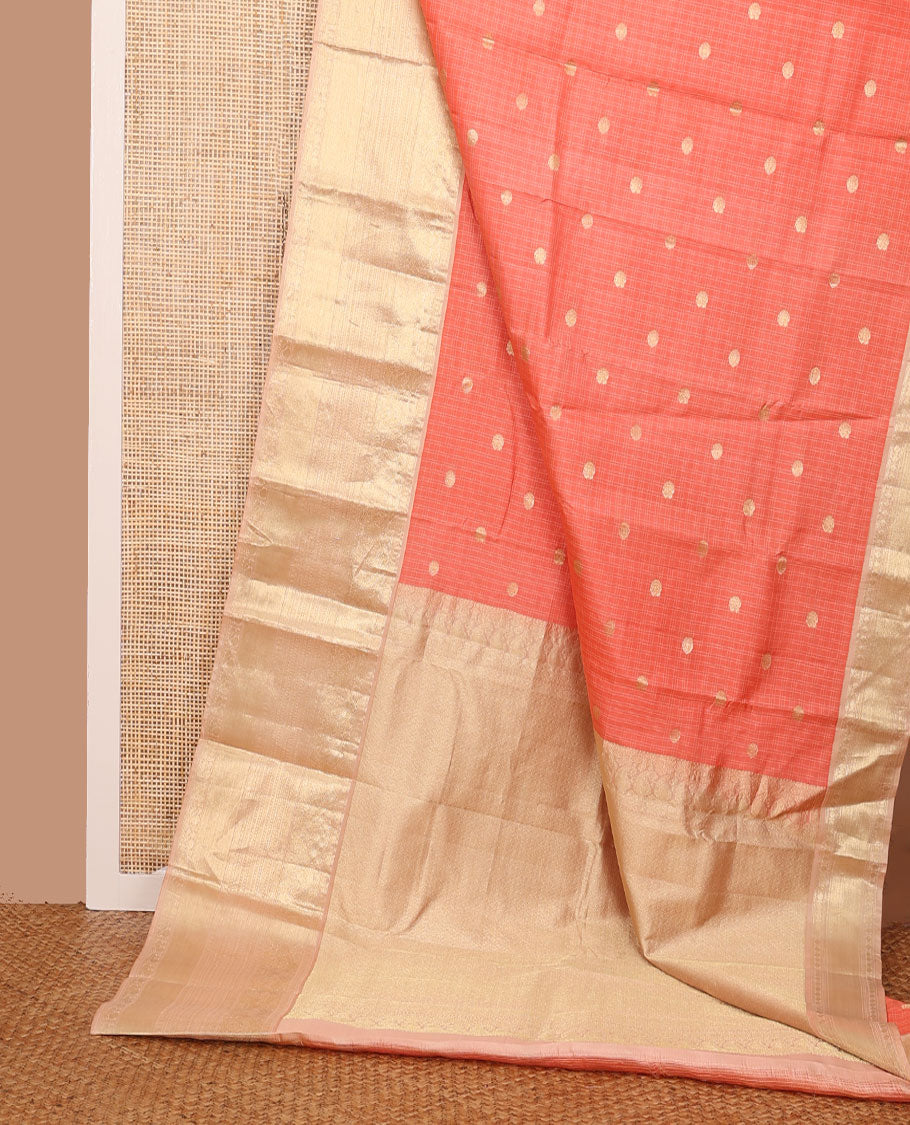 Peach checked annam chakram buttas silksaree, contrast jaal pallu & border of muthu, cross kamalam,mayil kann,neli & mayil designs