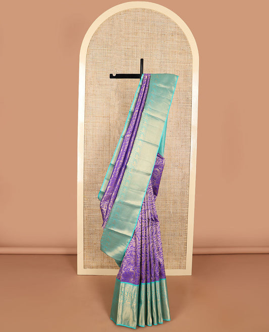 Purple jaal design kancheepuram silk saree with contrast border of rekku, muthu, poo chakram mayil design & zari design pallu