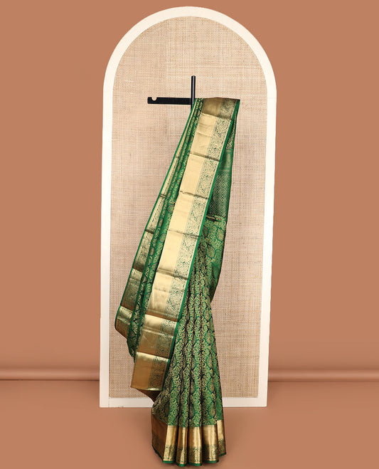 Green jacquard Kanchipuram wedding silk saree, zari border of rekku, laddu kamalam, and flora-paisley designs, and intricate pallu