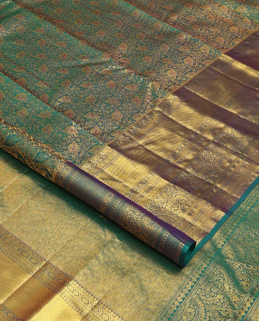 Green floral jacquard wedding silk saree, traditional zari border of thilakam mokku, kamalam, and mayil kann, and jaal pallu