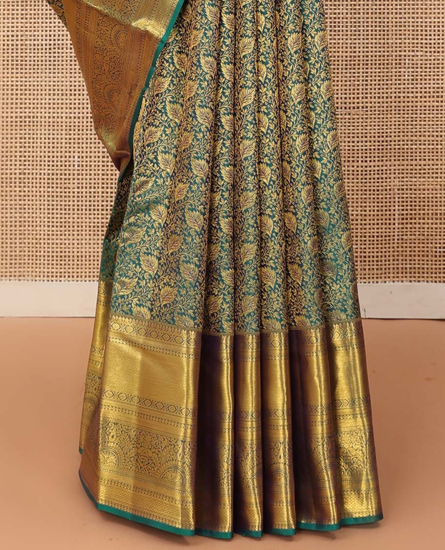 Green floral jacquard wedding silk saree, traditional zari border of thilakam mokku, kamalam, and mayil kann, and jaal pallu
