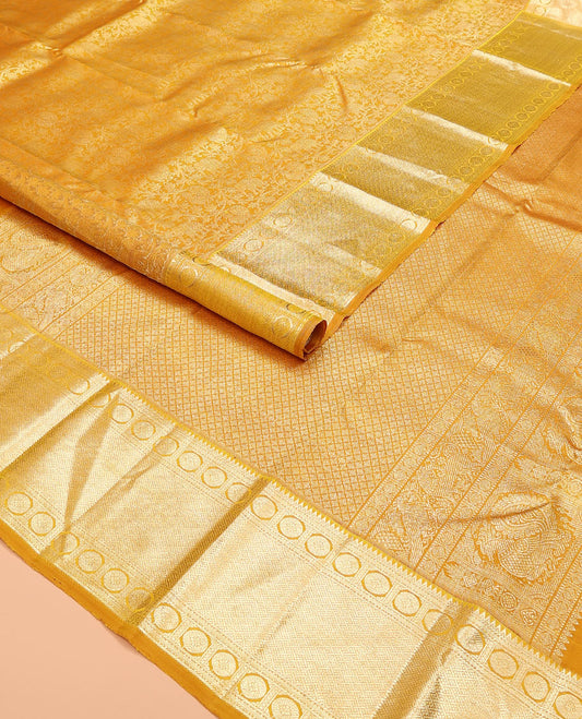 Yellow jacquard kanchipuram silk saree, zari border of rekku, neli, rudraksham, and jaal designs, and jaal pallu