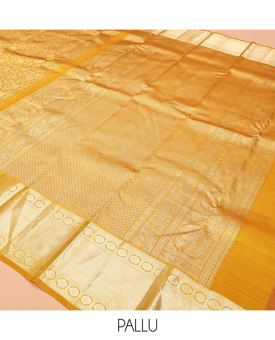 Yellow jacquard kanchipuram silk saree, zari border of rekku, neli, rudraksham, and jaal designs, and jaal pallu