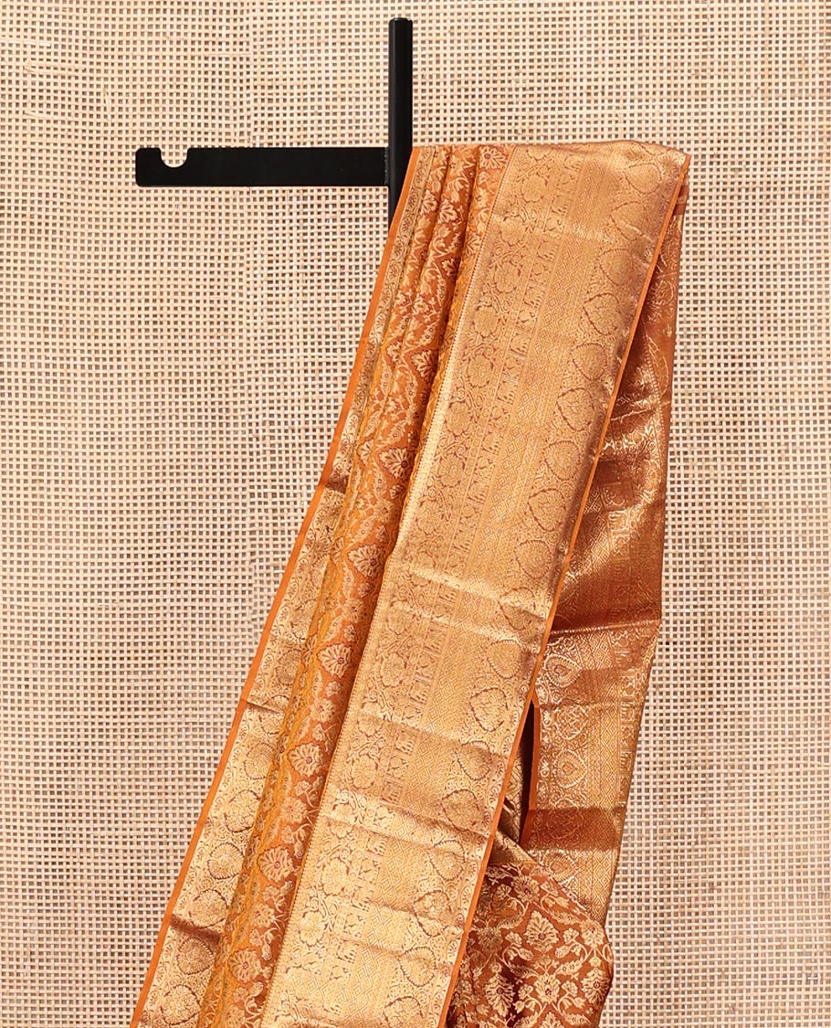 Orange Kanchipuram Wedding Silk Saree, Finely Crafted with Jacquard Designs on Its Body, Highlighted by a Zari Border of Thilakam, Kodi Visiry, Mayil, Yaanai, Jaal, and Lavangam Designs, Grand Ogee Patterned Pallu, and Paired with a Matching Blouse