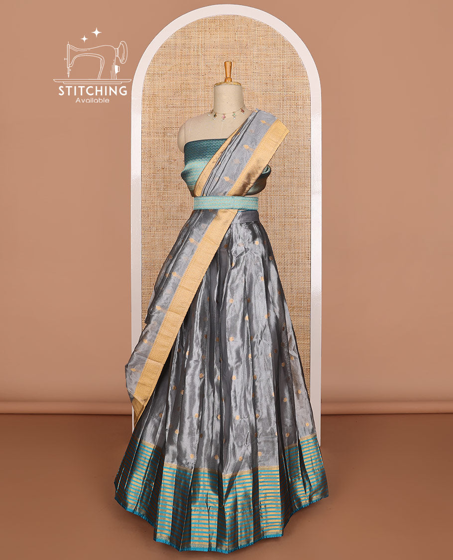 Dark grey buttas tissue half saree with contrast zari design border, jaal design blouse & floral design dhavani