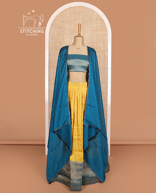 Yellow art silk half-saree, brocade with contrast traditional border skirt, contrast brocade blouse, scallop stone work dhavani, and and detachable belt