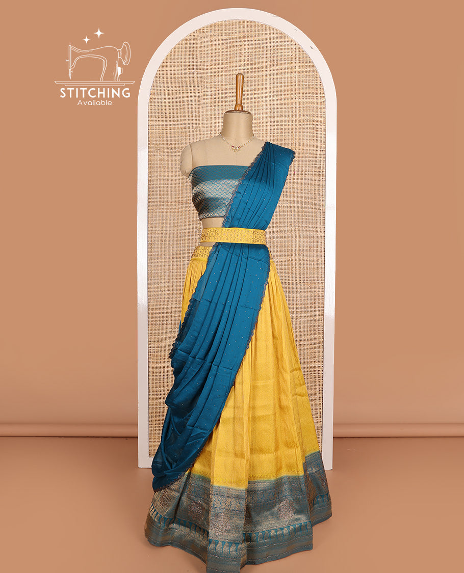 Yellow art silk half-saree, brocade with contrast traditional border skirt, contrast brocade blouse, scallop stone work dhavani, and and detachable belt
