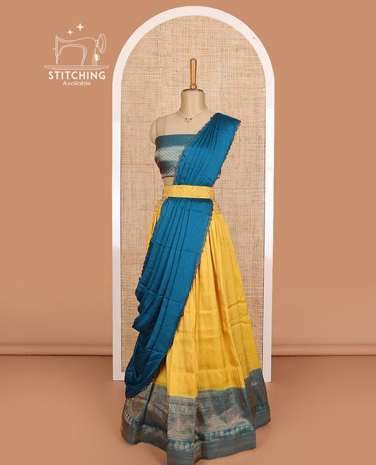Yellow art silk half-saree, brocade with contrast traditional border skirt, contrast brocade blouse, scallop stone work dhavani, and and detachable belt