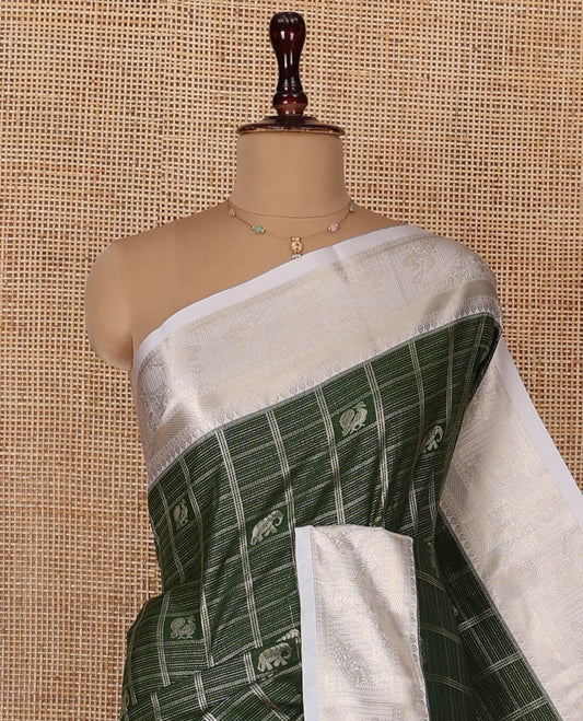 Green Budget Silk Saree, Mesmerized with Peacock and Elephant Motif Enclosed Checks, Complemented by a Contrast Traditional Zari Designs Woven Border, Pallu of Jaal Designs, and Paired with a Contrast Blouse