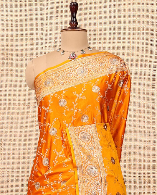 Yellow Banarasi Satin Saree, Delicately Woven with Floral Jaal Jacquard, a Floral Creeper Border, Intricate Stonework Pallu, and a Matching Blouse