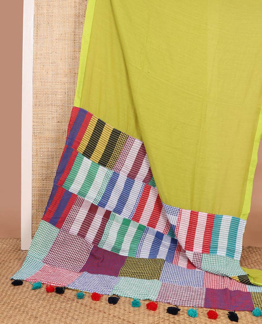 Borderless green plain khadi cotton saree, contrast kaleidoscope-colored patchwork style micro-checked pallu with colorful tassels