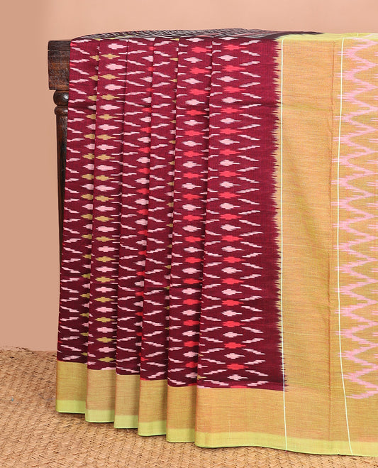 Maroon unique buttas woven ikkat cotton saree, contrast plain border, and pallu of chevron stripes