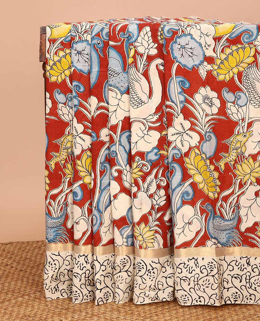 Maroon flora-fauna machine-printed Kalamkari cotton saree, contrast floral printed border, and pallu of big peacock print