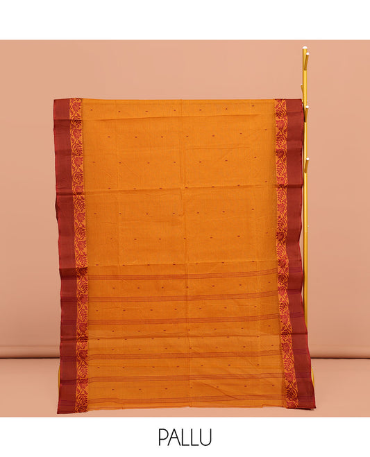 Orange Bengal Cotton Saree, Woven with Buttas on Its Body, Complemented by a Contrast Floral Creeper Design Border, Pallu of Stripes and Buttas, and Paired with a Matching Blouse