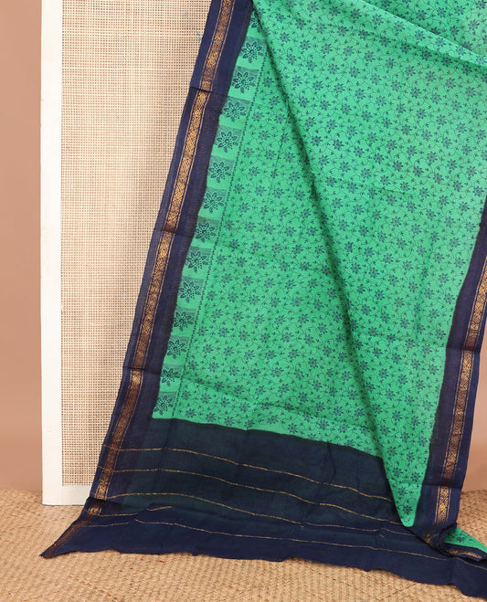 Green floral jaal printed Sungudi cotton saree, contrast traditional border & zari striped pallu