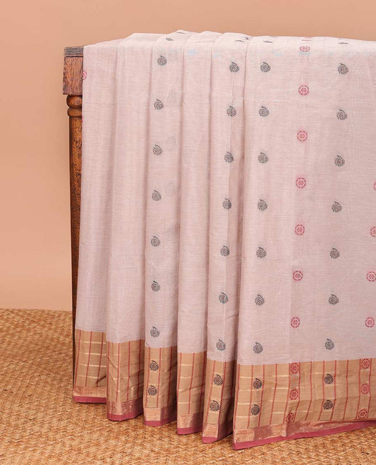 Pastel pink chakra, and paisley buttas Coimbatore cotton saree, contrast butta enclosed checked border, and pallu of paisleys and chevron design