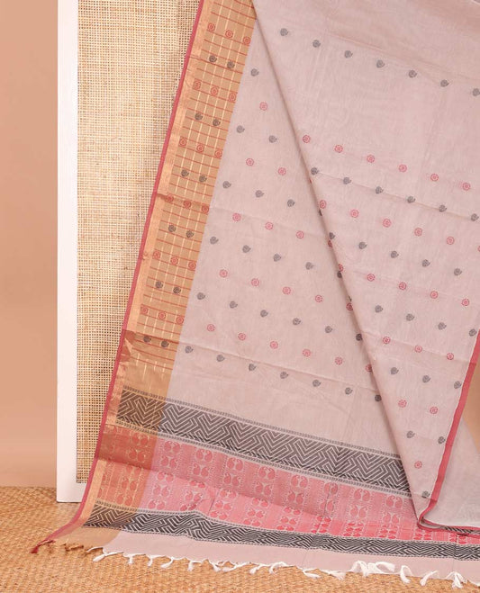 Pastel pink chakra, and paisley buttas Coimbatore cotton saree, contrast butta enclosed checked border, and pallu of paisleys and chevron design