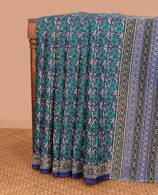 Blue floral printed mul mul cotton saree, contrast printed border, and pallu of intricate designs