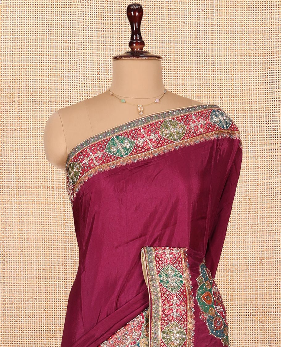 Wine Dola Silk Saree, Embellished with Rangoli-Style Colorful Embroidery on Its Body, Highlighted by an Embroidered Border, Pallu of Embroidery and Print Work, and Paired with a Matching Blouse