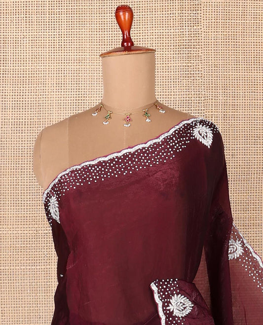 Maroon stone embroidered designer saree with unique motifs in embroidery, scallop stone work border