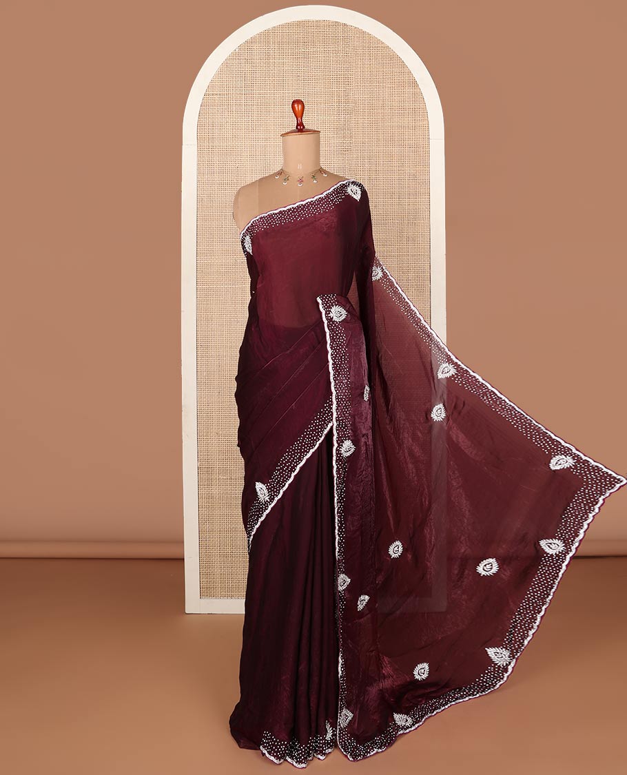 Maroon stone embroidered designer saree with unique motifs in embroidery, scallop stone work border