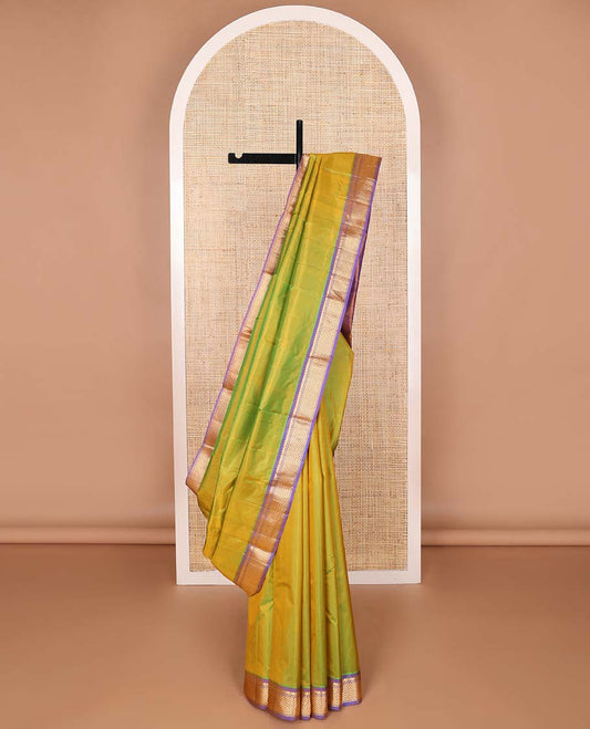 Green kancheepuram silk saree with contrast thilakam mokku, banaras, ara madam design & striped pallu