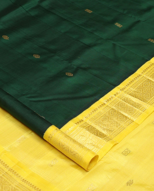 Green zari buttas Kanchipuram silk saree, contrast one-sided korvai border of thilakam mokku, banaras, muthu, and jaal designs, and zari design pallu