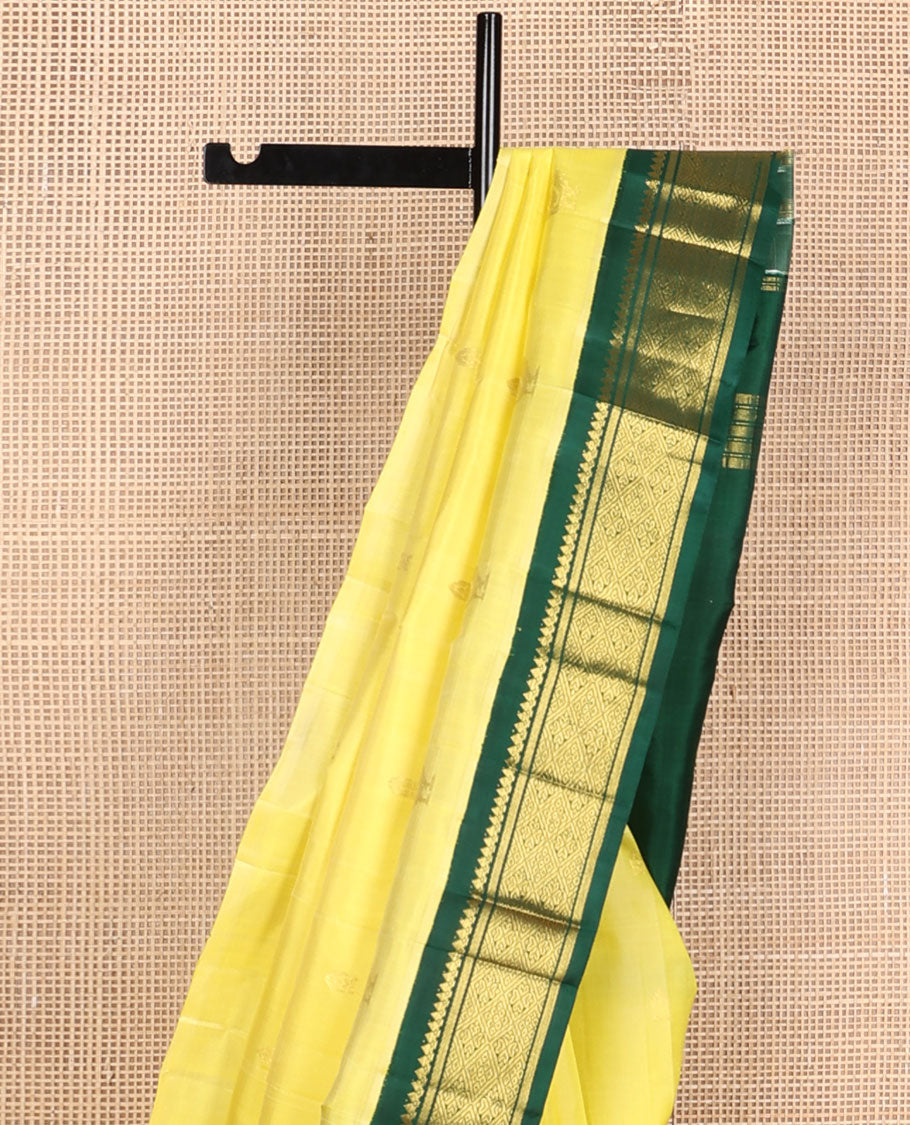 Yellow zari buttas kanchipuram silksaree, contrast one-sided korvai border of salngai & jaal design & mayil design pallu