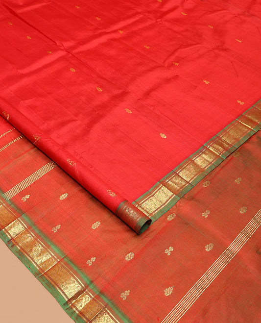 Red Kanchipuram Silk Saree, Embellished with Zari Buttas All Over Its Body, Complemented by a Contrast One-Sided Border of Banaras, and Jaal Designs, Pallu of Zari Designs, and Comes Without a Blouse