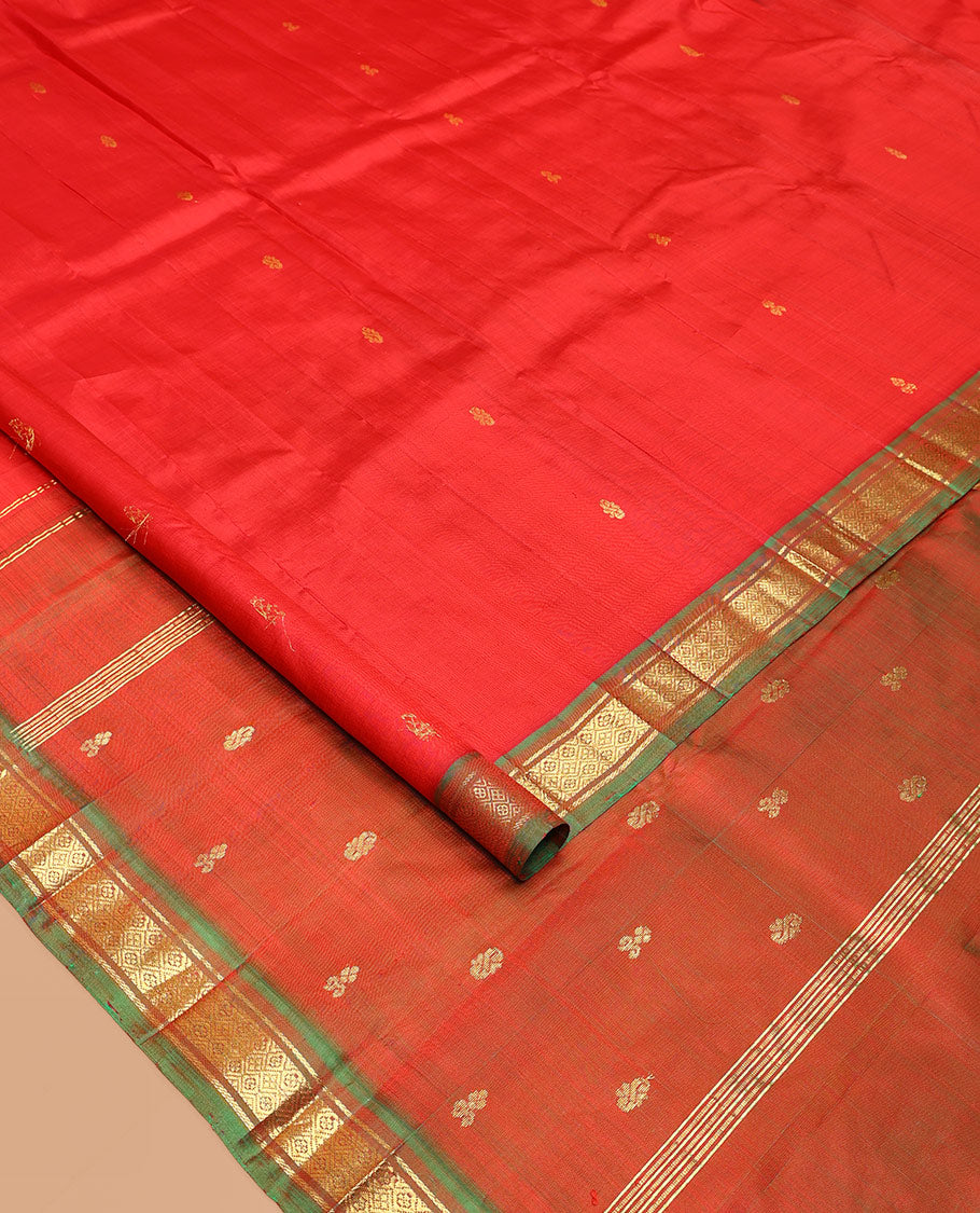 Red Kanchipuram Silk Saree, Embellished with Zari Buttas All Over Its Body, Complemented by a Contrast One-Sided Border of Banaras, and Jaal Designs, Pallu of Zari Designs, and Comes Without a Blouse
