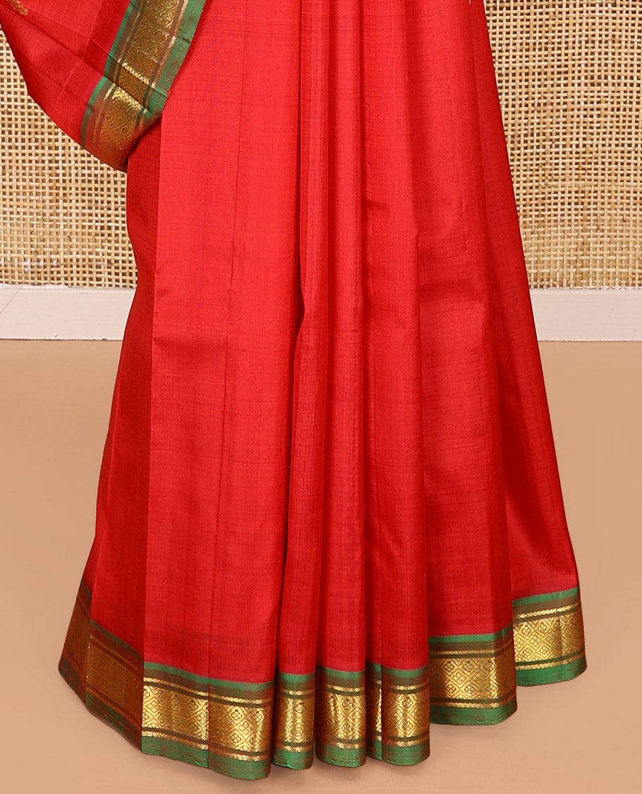 Red Kanchipuram Silk Saree, Embellished with Zari Buttas All Over Its Body, Complemented by a Contrast One-Sided Border of Banaras, and Jaal Designs, Pallu of Zari Designs, and Comes Without a Blouse