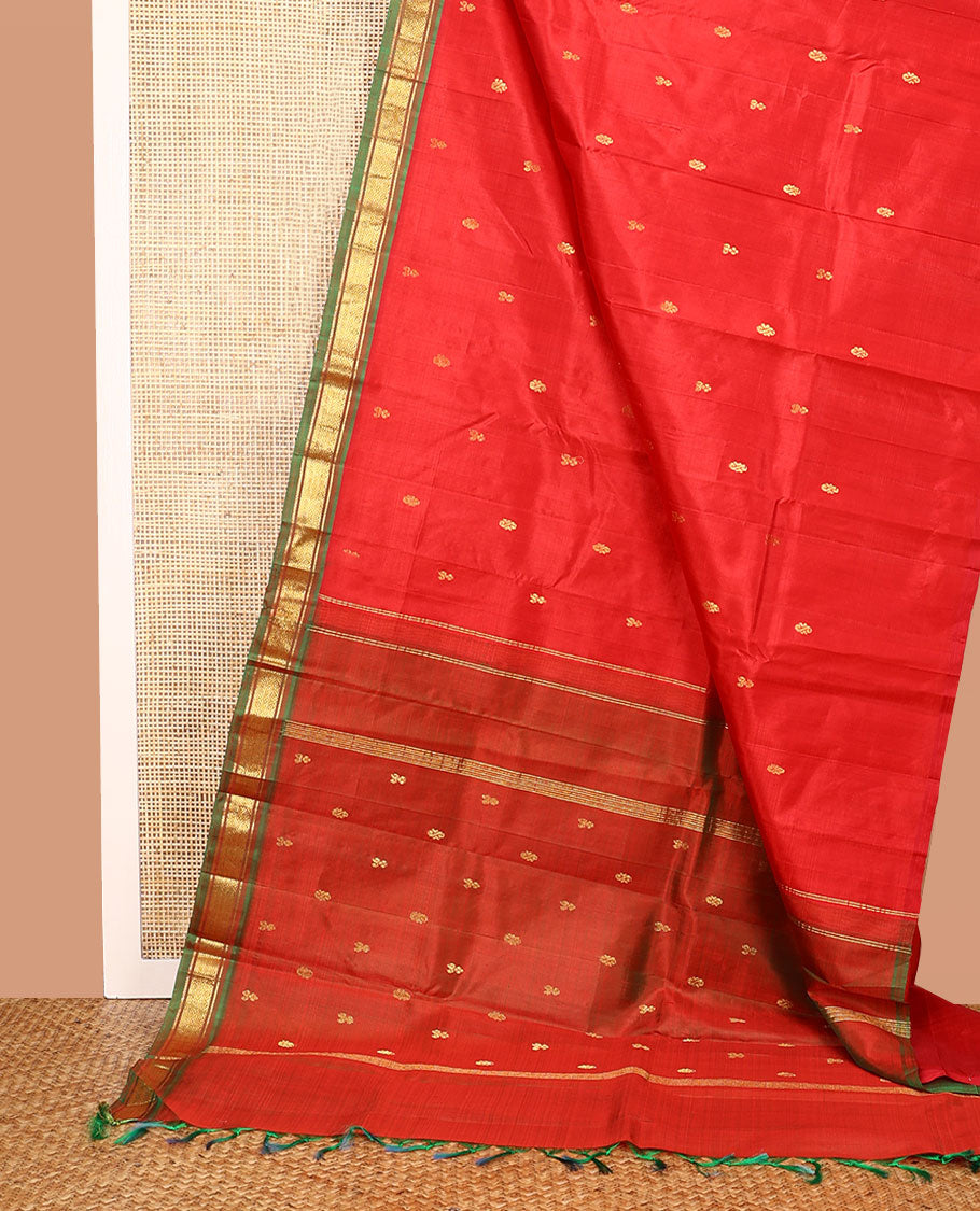 Red Kanchipuram Silk Saree, Embellished with Zari Buttas All Over Its Body, Complemented by a Contrast One-Sided Border of Banaras, and Jaal Designs, Pallu of Zari Designs, and Comes Without a Blouse