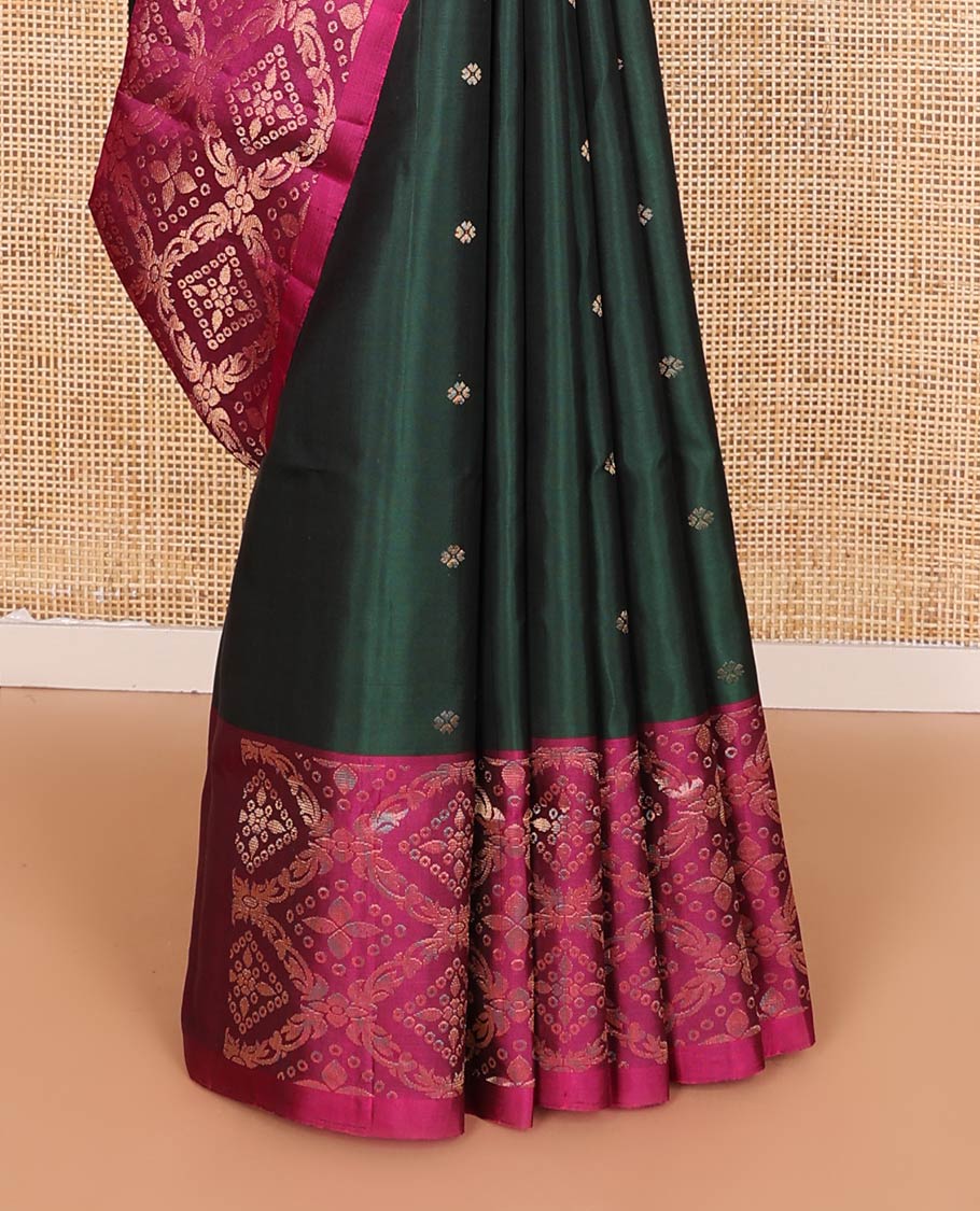 Deep green zari buttas soft silk saree, contrast jaal patterned border, and pallu of intricate design