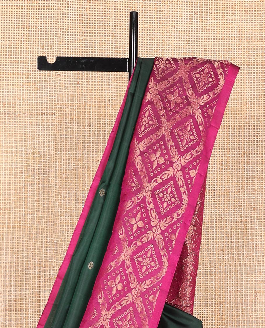 Deep green zari buttas soft silk saree, contrast jaal patterned border, and pallu of intricate design