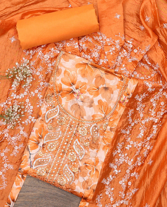 Orange material chudidar set, floral print and neck embroidered top, plain bottom, and floral jaal embroidered dupatta