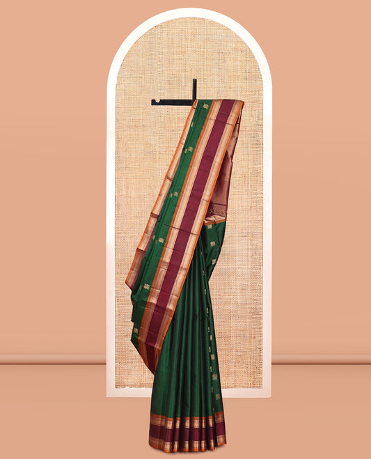 Green Vasundhara Lite Silk Mix Saree Features Mayil Buttas and Stripes, a Contrast Rettai Pettu Border of Salngai, Banaras, Neli, Kuyil, Kann, and Vanki Designs, Mayil Kann Pallu, and a Contrast Blouse