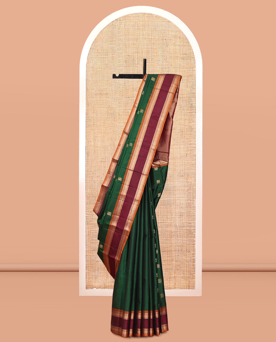 Green Vasundhara Lite Silk Mix Saree Features Mayil Buttas and Stripes, a Contrast Rettai Pettu Border of Salngai, Banaras, Neli, Kuyil, Kann, and Vanki Designs, Mayil Kann Pallu, and a Contrast Blouse