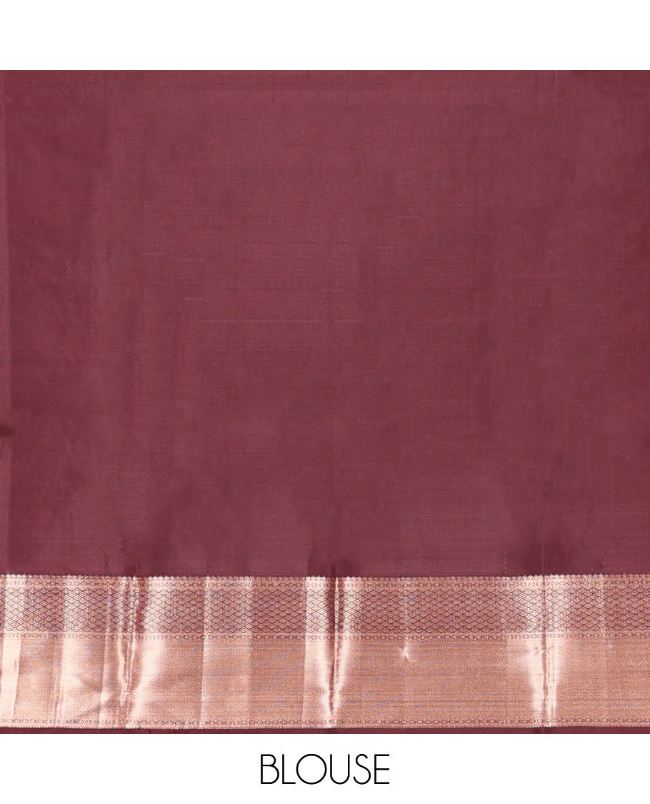 Brown Vasundhara Silk Saree Elegantly Sparkled with Floral Jaal Design All Over Its Body, Complemented by a Zari Border of Thilakam Mokku, Lavangam, Kathir, and Jaal Designs, Pallu Depicting Zari Jaal Designs, and Paired with a Matching Blouse