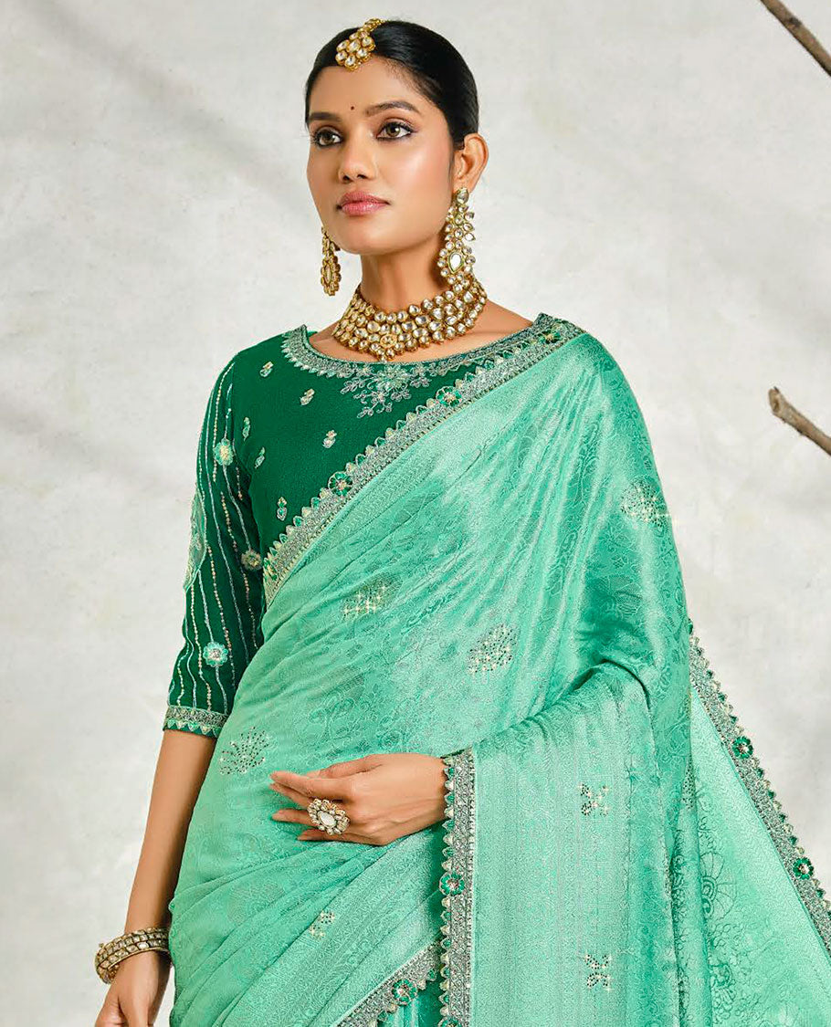 Turquoise floral embossed & stonework designer saree, traditional design & lace work scallop border & intricate stonework pallu