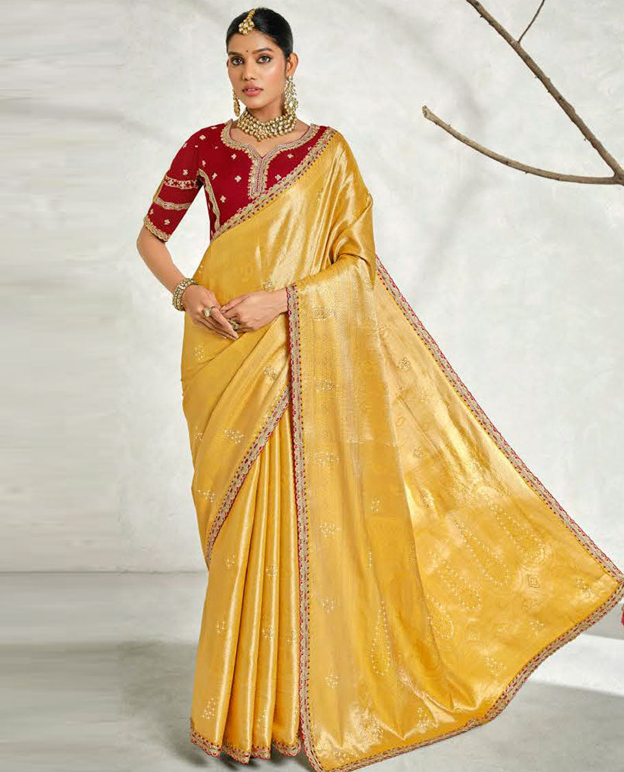 Yellow floral embossed & stonework designer saree, traditional design & lace work scallop border & intricate stonework pallu