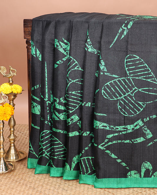 Borderless black printed orchid design semi khadhi saree with printed self, tussels pallu, green border & all over dotted blouse (Copy)