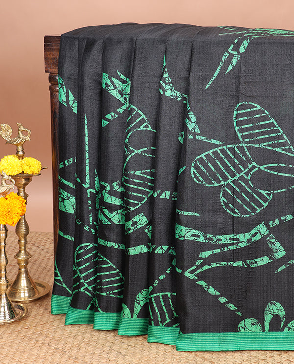 Borderless black printed orchid design semi khadhi saree with printed self, tussels pallu, green border & all over dotted blouse (Copy)