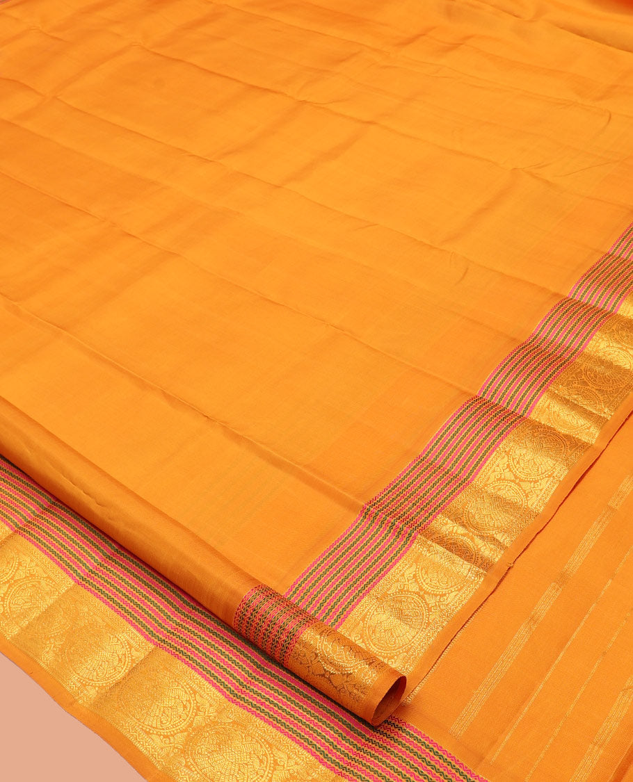 Yellow Plain Kanchipuram Silk Saree, Highlighted by Self-Border of Neli, Muthu, and Iru Thalai Pakshi Designs, a Self-Pallu, and Matching Blouse